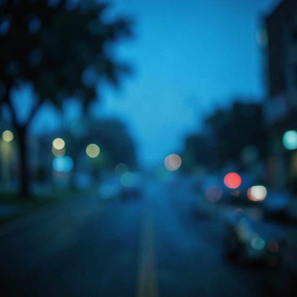 a wide cinematic shot of a dark home theater screen glowing with blue light, shallow depth of field, moody atmosphere